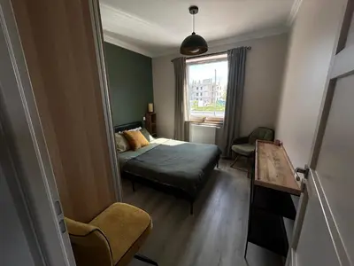 Łóżko lub łóżka w pokoju w obiekcie Przytulny apartament