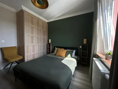 Łóżko lub łóżka w pokoju w obiekcie Przytulny apartament