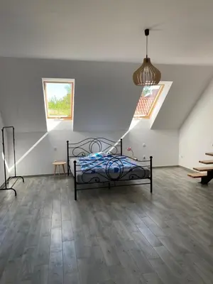 Łóżko lub łóżka w pokoju w obiekcie Agroturystyka Borów - pokoje