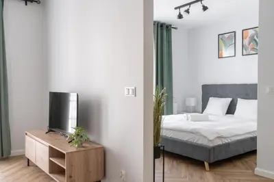 Łóżko lub łóżka w pokoju w obiekcie RentPlanet - Apartament Reja