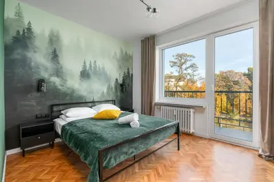 Łóżko lub łóżka w pokoju w obiekcie Oldtown Parkview Apartment