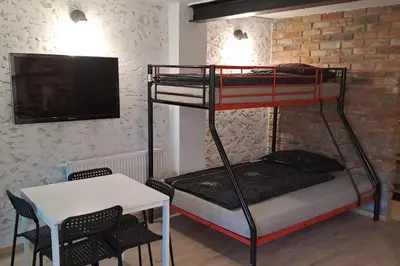 Łóżko lub łóżka w pokoju w obiekcie Loft House Noclegi Nysa