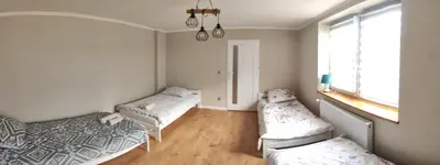Łóżko lub łóżka w pokoju w obiekcie Pod Orzechem Włoskim