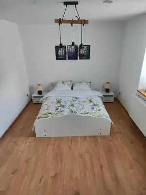 Łóżko lub łóżka w pokoju w obiekcie Pod Orzechem Włoskim