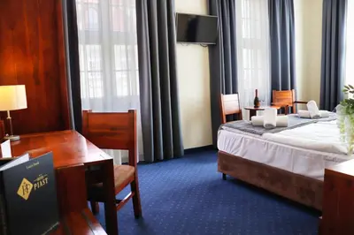 Łóżko lub łóżka w pokoju w obiekcie Hotel Piast Wrocław Centrum