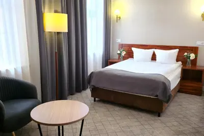 Łóżko lub łóżka w pokoju w obiekcie Hotel Piast Wrocław Centrum