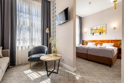 Łóżko lub łóżka w pokoju w obiekcie Hotel Piast Wrocław Centrum