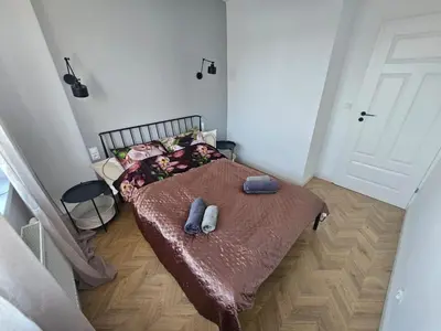 Łóżko lub łóżka w pokoju w obiekcie TG Loft Apartments