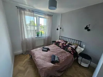 Łóżko lub łóżka w pokoju w obiekcie TG Loft Apartments
