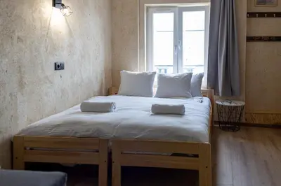 Łóżko lub łóżka w pokoju w obiekcie RentPlanet - Apartament Rejtana