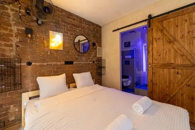 Łóżko lub łóżka w pokoju w obiekcie RentPlanet - Apartament Rejtana
