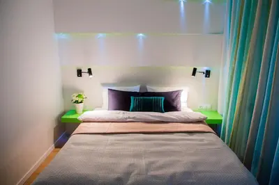 Łóżko lub łóżka w pokoju w obiekcie Mojito Apartments – Botanica