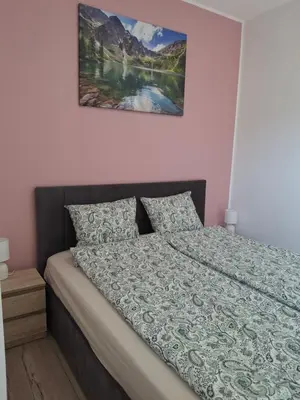 Łóżko lub łóżka w pokoju w obiekcie Apartament na Krupie
