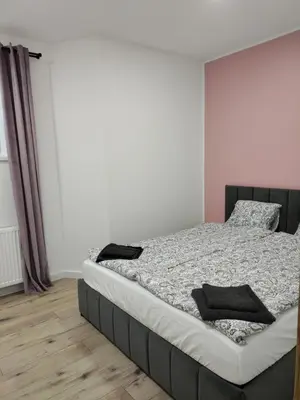 Łóżko lub łóżka w pokoju w obiekcie Apartament na Krupie