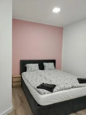 Łóżko lub łóżka w pokoju w obiekcie Apartament na Krupie