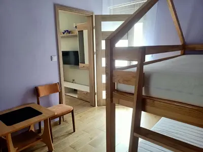 Łóżko lub łóżka w pokoju w obiekcie Biała Grusza