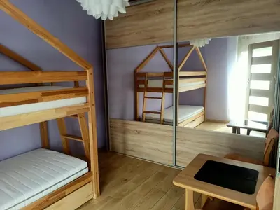 Łóżko lub łóżka w pokoju w obiekcie Biała Grusza