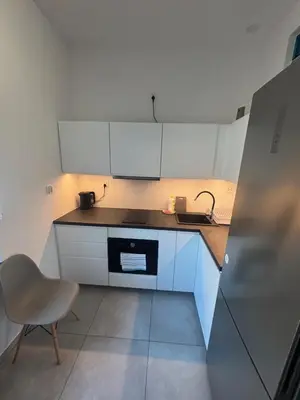 Kuchnia lub aneks kuchenny w obiekcie DWORCOWA 5 LOFT Numer 1