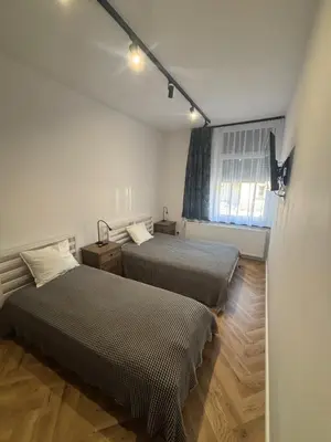 Łóżko lub łóżka w pokoju w obiekcie DWORCOWA 5 LOFT Numer 1