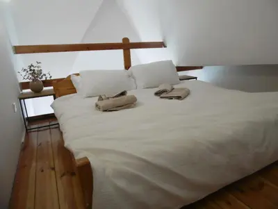 Łóżko lub łóżka w pokoju w obiekcie Mezzanine appartment