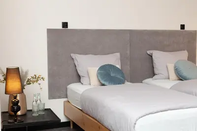 Łóżko lub łóżka w pokoju w obiekcie 