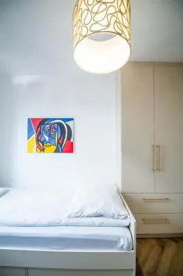 Łóżko lub łóżka w pokoju w obiekcie Apartament Mikołowska z Tarasem