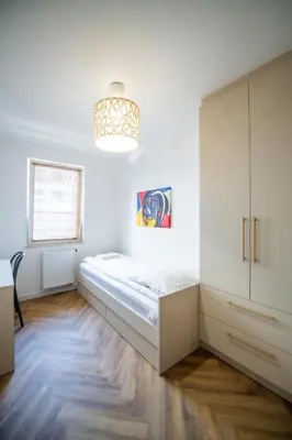Łóżko lub łóżka w pokoju w obiekcie Apartament Mikołowska z Tarasem