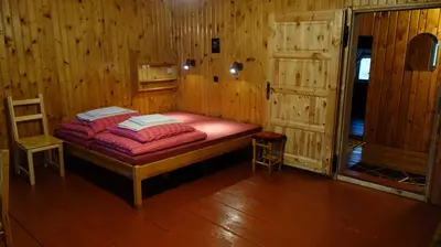 Łóżko lub łóżka w pokoju w obiekcie Agrowczasy Góry Bystrzyckie