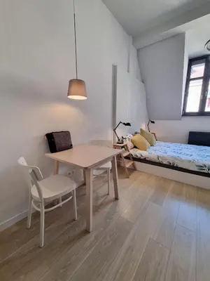 Łóżko lub łóżka w pokoju w obiekcie Cozy Pokój