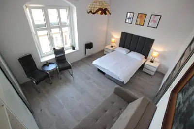 Łóżko lub łóżka w pokoju w obiekcie Apartament Rodzinny II