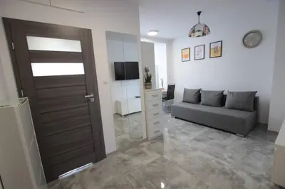 Telewizja i/lub zestaw kina domowego w obiekcie Apartament Rodzinny II