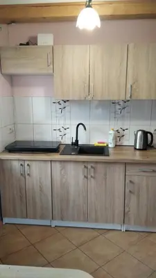 Kuchnia lub aneks kuchenny w obiekcie Domki Letniskowe Konik 2