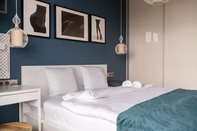 Łóżko lub łóżka w pokoju w obiekcie RentPlanet - Odra Tower
