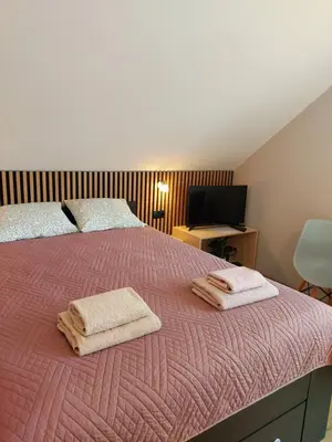 Łóżko lub łóżka w pokoju w obiekcie Relaks w Wilczycach