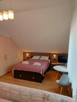 Łóżko lub łóżka w pokoju w obiekcie Relaks w Wilczycach