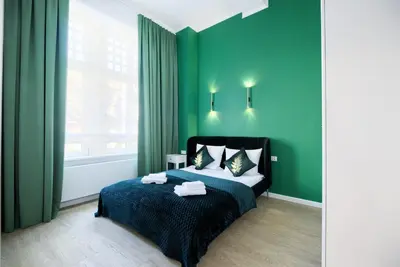 Łóżko lub łóżka w pokoju w obiekcie AboutArtApartments - 3840