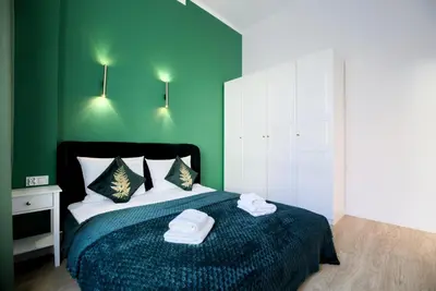 Łóżko lub łóżka w pokoju w obiekcie AboutArtApartments - 3840