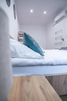 Łóżko lub łóżka w pokoju w obiekcie Apartament Łokietka