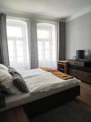 Łóżko lub łóżka w pokoju w obiekcie Mieszkanie na Nadodrzu