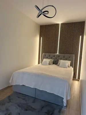 Łóżko lub łóżka w pokoju w obiekcie Luksusowy Apartament River Point Kępa Mieszczańska