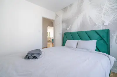 Łóżko lub łóżka w pokoju w obiekcie Apartament Turkusowy Self Check In