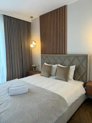 Łóżko lub łóżka w pokoju w obiekcie Apartamentowiec Opole 2
