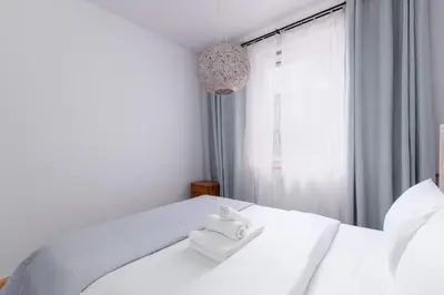 Łóżko lub łóżka w pokoju w obiekcie Paryski Zakątek Cosy Apartment by BookingHost