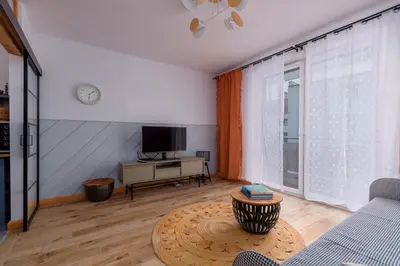 Telewizja i/lub zestaw kina domowego w obiekcie Paryski Zakątek Cosy Apartment by BookingHost