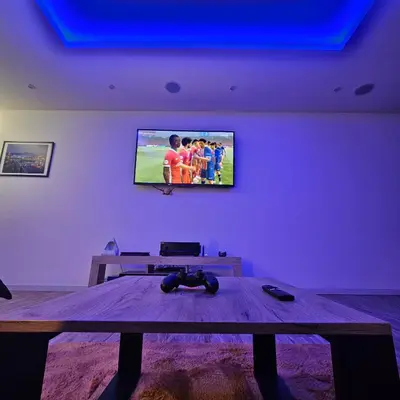 Telewizja i/lub zestaw kina domowego w obiekcie Apartament Tęczowy