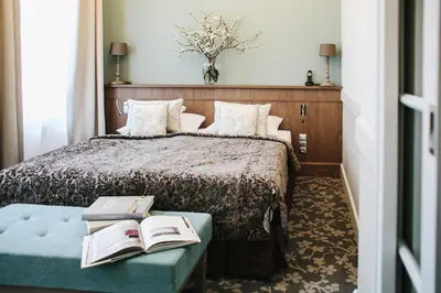 Łóżko lub łóżka w pokoju w obiekcie Art Hotel
