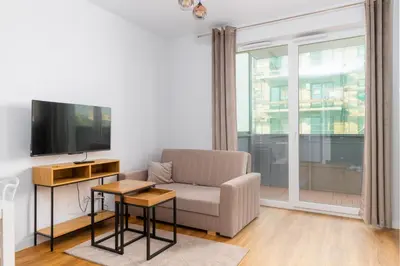 Telewizja i/lub zestaw kina domowego w obiekcie Park Skowroni Cosy Apartment by BookingHost