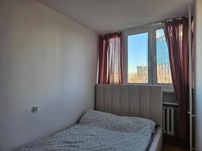 Łóżko lub łóżka w pokoju w obiekcie Mound Apartment