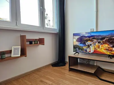 Telewizja i/lub zestaw kina domowego w obiekcie Mound Apartment