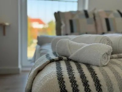 Łóżko lub łóżka w pokoju w obiekcie Kościuszki 4 Comfort Suites